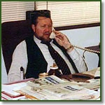 Joe Scheidler at his desk in the League offices, 1980
