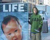 Boy with LIFE Sign