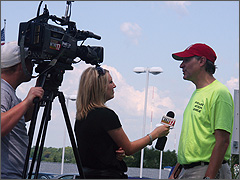Eric Scheidler gives an interview to a reporter from WTVO Channel 17 during the Rockford, IL Truth Day, Aug. 12