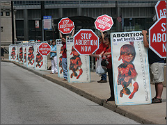 Graphic abortion signs at the League's protest of Obama at the AMA convention