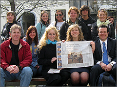Pro-life group with newspaper covering their activities