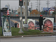 Pro-lifers hold graphic abortion signs in Melrose Park, IL