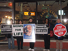 Pro-lifers outside of Theo's Java Club in Rock Island