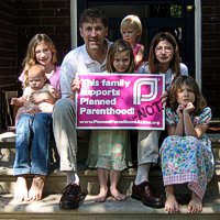 Eric and girls w. captured PP sign