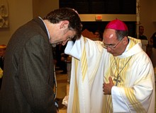 Bishop Sartain blesses Eric Scheidler