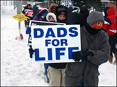 Picketer with a "Dad's for Life" sign