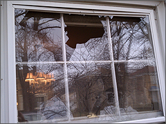 Broken window at Joe and Ann Scheidler's home