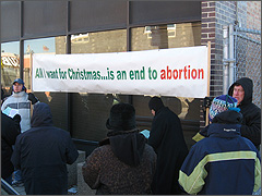 Carolers at Albany abortion clinic