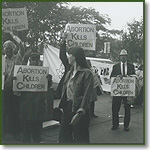 Joe Scheidler leads an abortion protest on Michigan Avenue in Chicago