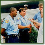 Police talk to Fr. Paul Marx outside an abortion clinic