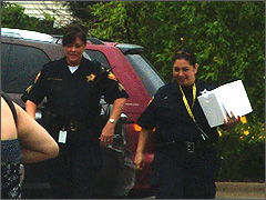 Aurora Police officers with the mysterious white box outside Planned Parenthood Aurora