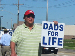 Pro-life men march at the June protest of Planned Parenthood in Aurora, Illinois