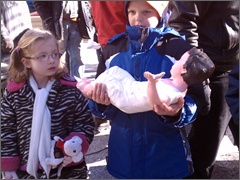 Children bring Jesus to the Manger at Daley Plaza