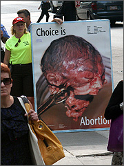 Ann Scheidler holds 3rd trimester abortion sign