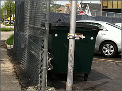 The abortion clinic's dumpster, where our signs were tossed.