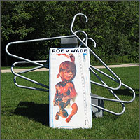 Coat hanger sculpture and Malachi abortion sign