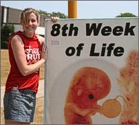 girl holding pro-life sign