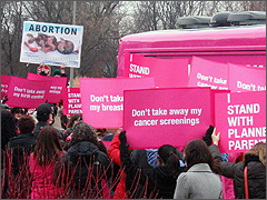 Graphic abortion sign at Planned Parenthood's rally