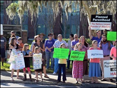 Pro-life activists protest outside Planned Parenthood facility in Kissimmee, Florida, April 2014