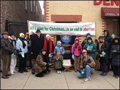 caroling in front of All Women's Health abortion clinic in Chicago