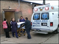 A woman is transported into an ambulance at the Albany Medical/Surgical Center abortion clinic in Chicago, December 20