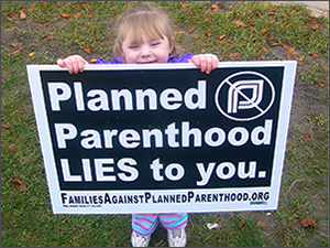 Little girl with Planned Parenthood Lies to You sign